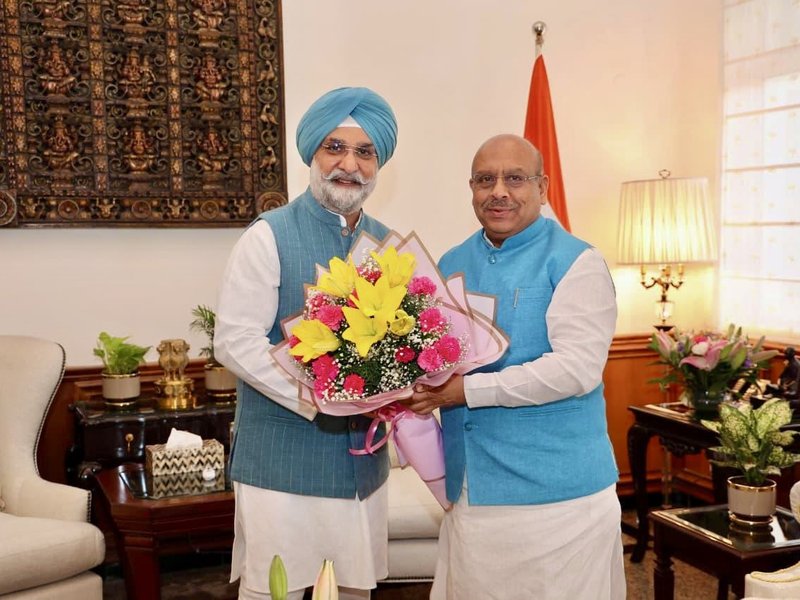 Delhi Assembly Speaker presents magazine to L-G