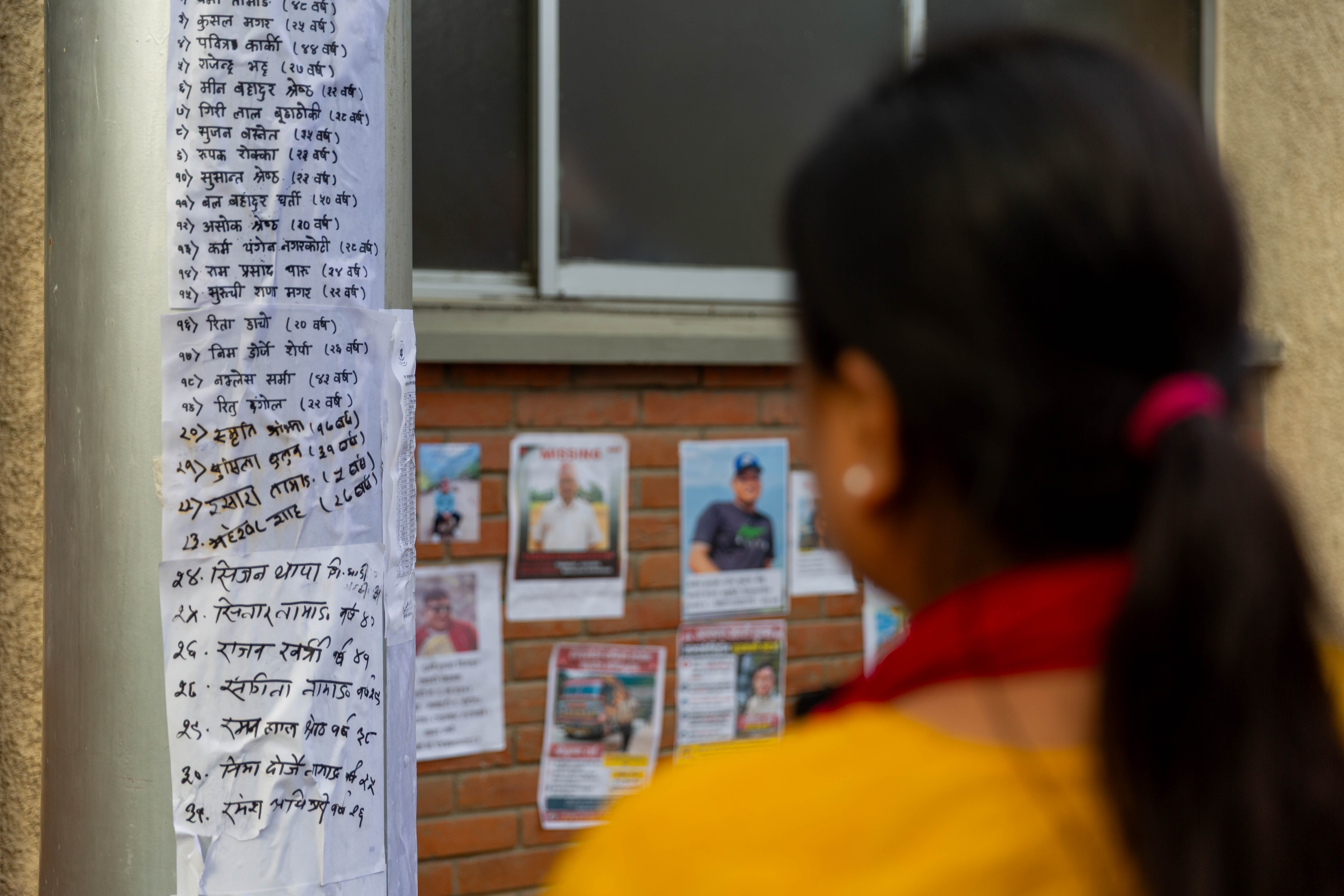 Families put up posters outside Kathmandu hospital in hope of finding their loved ones